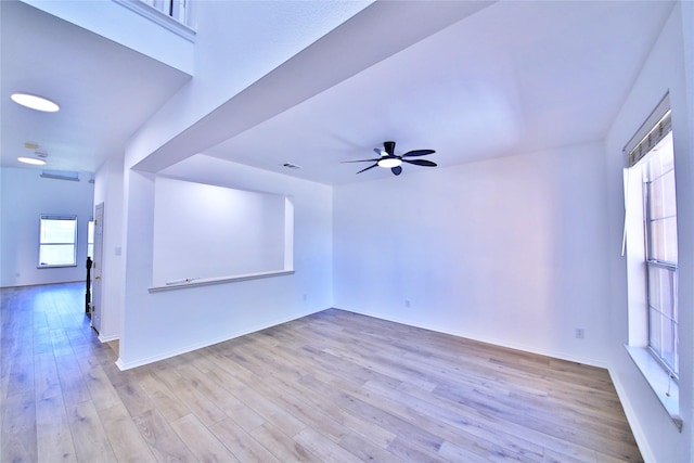 2328 Twilight Star Dr, Little Elm, TX 75068 - unfurnished living room featuring wood finished floors, ceiling fan, and baseboards