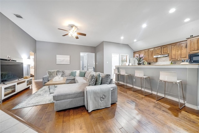 10312 Flat Creek Trl, Mckinney, TX 75072 - living room featuring ceiling fan, light wood finished floors, recessed lighting, vaulted ceiling, and visible vents