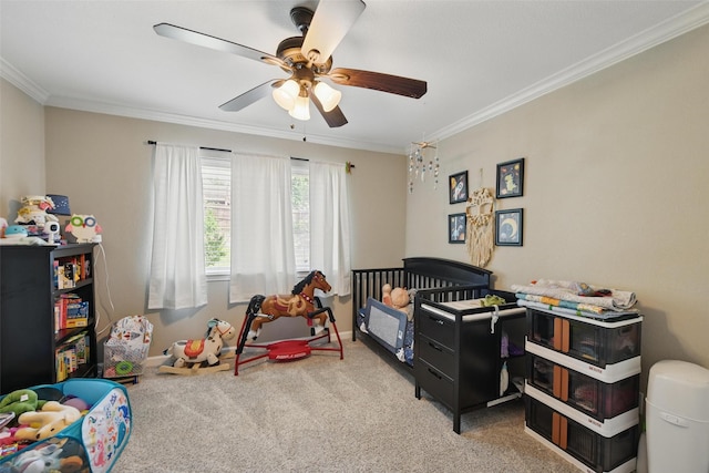 bedroom with carpet floors, a ceiling fan, and crown molding
