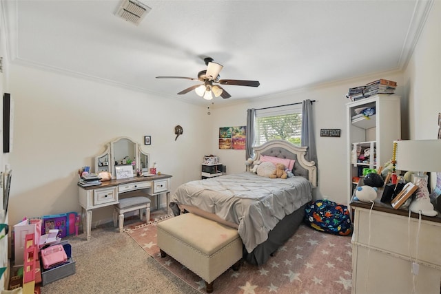 carpeted bedroom featuring crown molding, ceiling fan, and visible vents