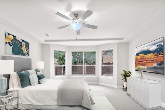 3020 Nyala Trl, Frisco, TX 75034 - bedroom with a ceiling fan, visible vents, baseboards, carpet, and a tray ceiling