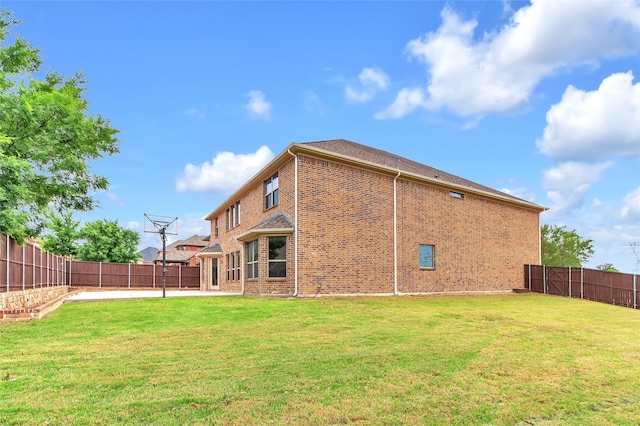 3020 Nyala Trl, Frisco, TX 75034 - back of property with brick siding, a fenced backyard, a patio area, and a yard
