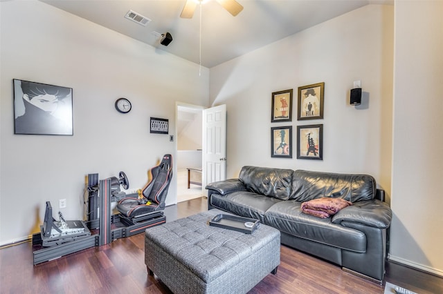 living area featuring visible vents, ceiling fan, and wood finished floors