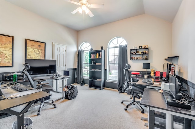 carpeted home office with a ceiling fan and lofted ceiling