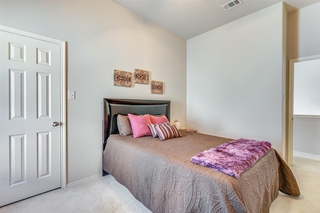 bedroom with carpet floors, baseboards, and visible vents