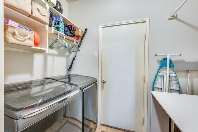 clothes washing area with laundry area and washer and clothes dryer