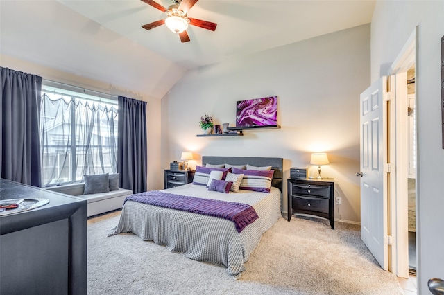 carpeted bedroom featuring a ceiling fan, baseboards, and vaulted ceiling