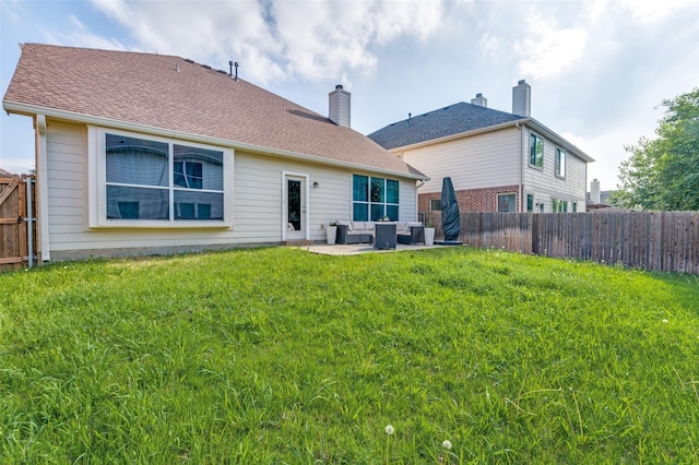 rear view of house featuring a yard, an outdoor hangout area, a fenced backyard, and a patio area