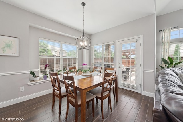 13283 Bodega Trl, Frisco, TX 75035 - dining room with baseboards, a chandelier, a healthy amount of sunlight, and dark wood-style floors