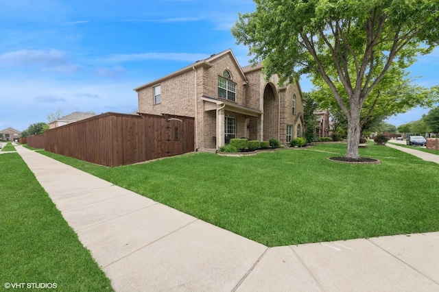 13283 Bodega Trl, Frisco, TX 75035 - view of front of property with brick siding, a front lawn, and fence