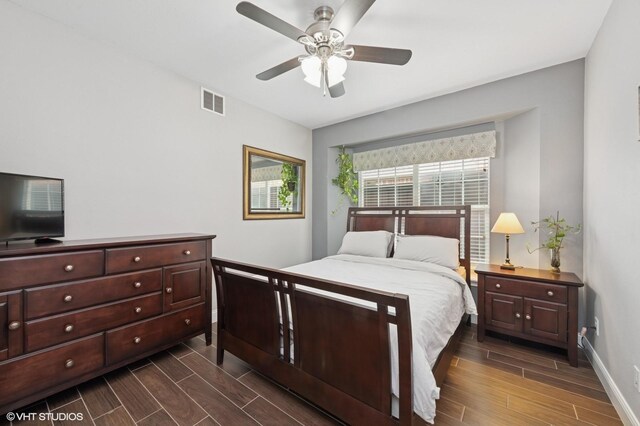 13283 Bodega Trl, Frisco, TX 75035 - bedroom with visible vents, a ceiling fan, baseboards, and wood finish floors