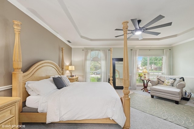 13283 Bodega Trl, Frisco, TX 75035 - carpeted bedroom with visible vents, multiple windows, a raised ceiling, and access to exterior
