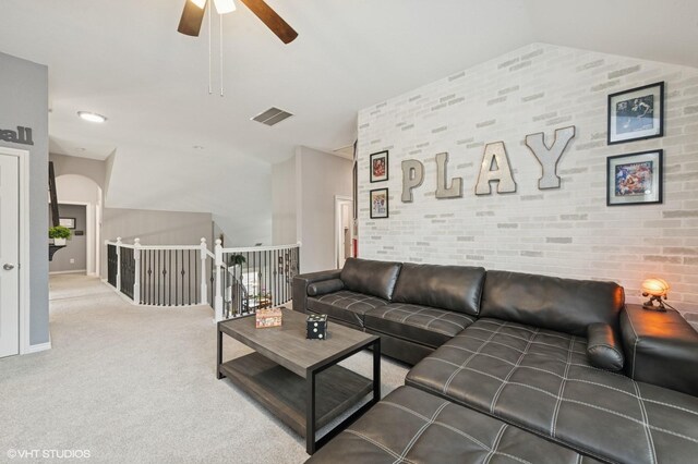 13283 Bodega Trl, Frisco, TX 75035 - living area with visible vents, carpet floors, brick wall, ceiling fan, and vaulted ceiling