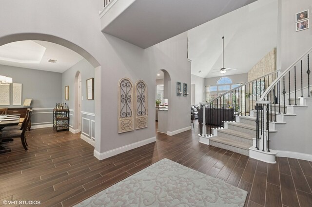 13283 Bodega Trl, Frisco, TX 75035 - foyer featuring stairway, arched walkways, baseboards, and wood finish floors