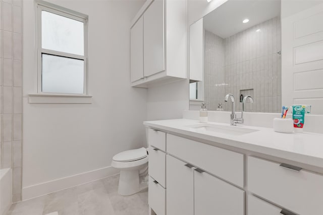 full bath with toilet, baseboards, recessed lighting, and vanity