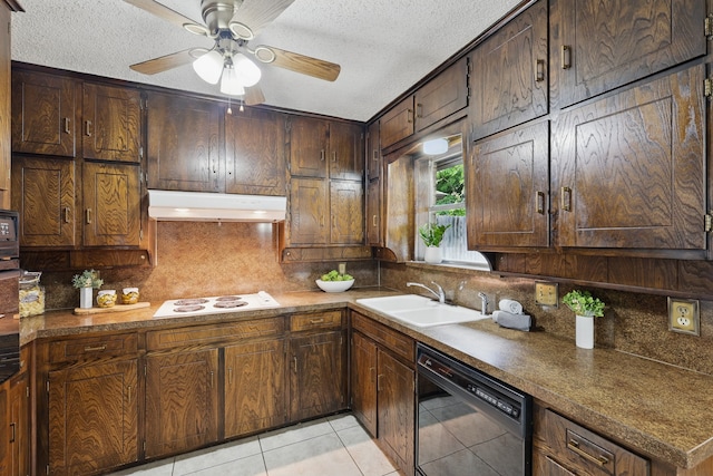 kitchen with under cabinet range hood, dishwasher, a sink, decorative backsplash, and a textured ceiling