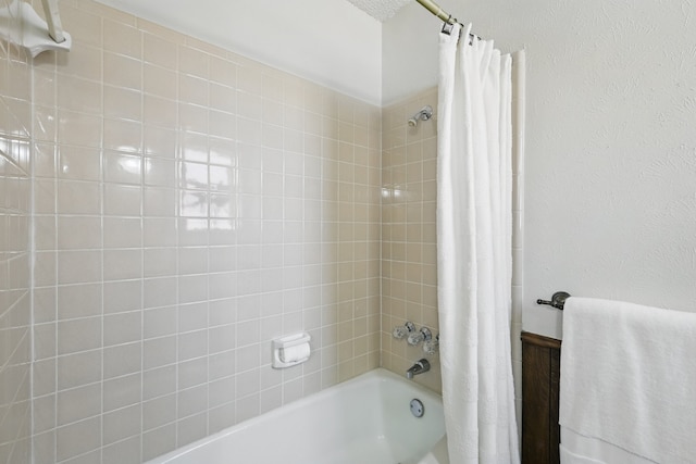 bathroom with shower / bathtub combination with curtain