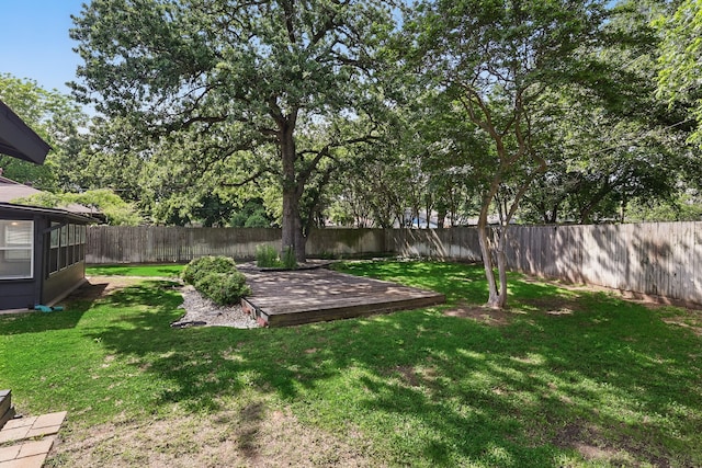 view of yard featuring a wooden deck