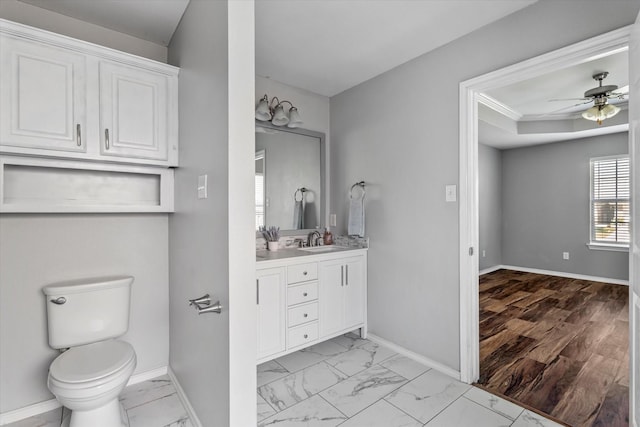 817 Countryside Dr, Aubrey, TX 76227 - bathroom featuring vanity, baseboards, marble finish flooring, ceiling fan, and toilet