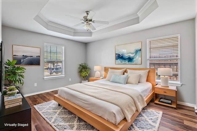 817 Countryside Dr, Aubrey, TX 76227 - bedroom featuring ornamental molding, a raised ceiling, wood finished floors, baseboards, and ceiling fan