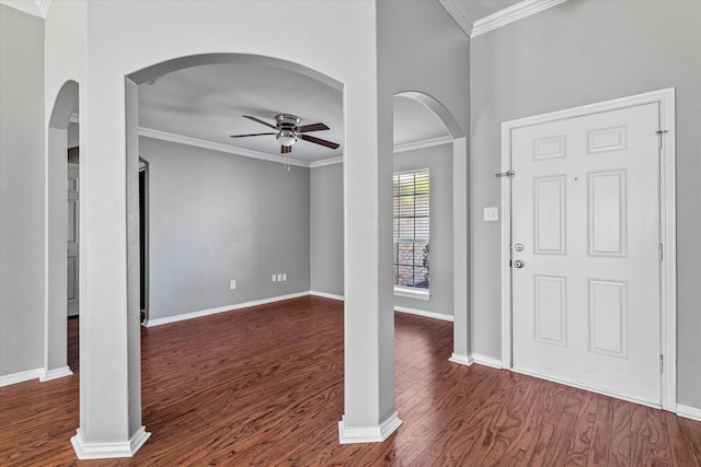 817 Countryside Dr, Aubrey, TX 76227 - entrance foyer with ceiling fan, dark wood finished floors, ornamental molding, baseboards, and arched walkways