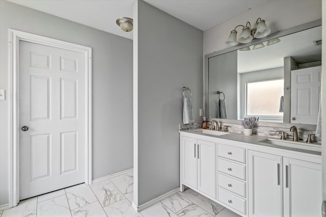 817 Countryside Dr, Aubrey, TX 76227 - bathroom with double vanity, marble finish floors, and baseboards