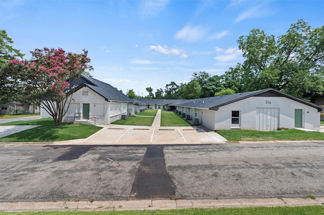 bungalow-style house featuring a front yard