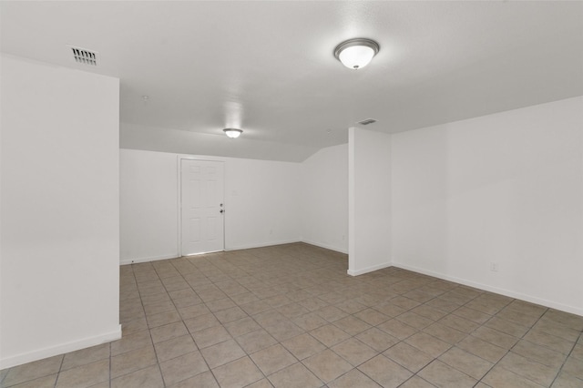 unfurnished room featuring baseboards and visible vents