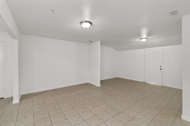 unfurnished room featuring visible vents and baseboards