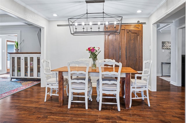 dining space with a chandelier, ornamental molding, wood finished floors, recessed lighting, and baseboards