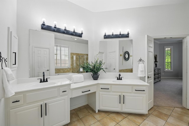 full bath featuring double vanity, a sink, and tile patterned floors