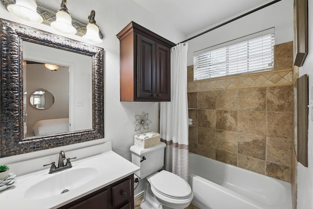 bathroom with vanity, toilet, and shower / tub combo