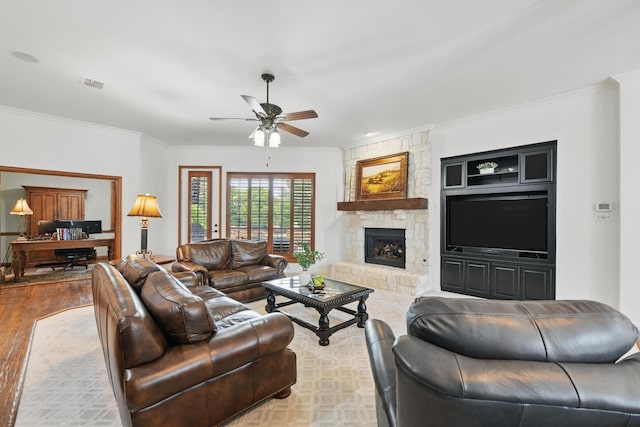 living area featuring ornamental molding, a ceiling fan, wood finished floors, and visible vents