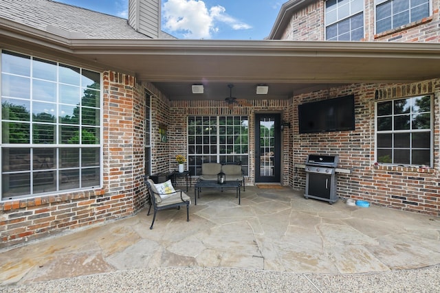 view of patio featuring a ceiling fan and grilling area