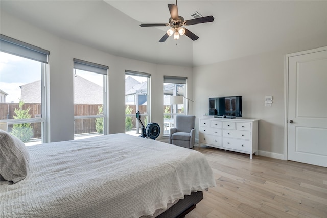 bedroom featuring baseboards, a ceiling fan, light wood-type flooring, and visible vents