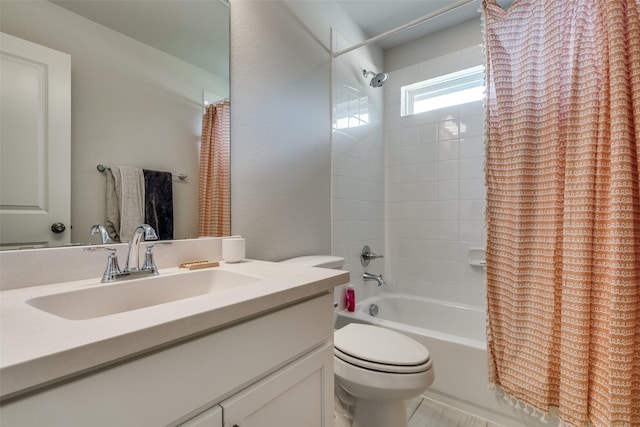 full bathroom with vanity, toilet, and shower / tub combo with curtain