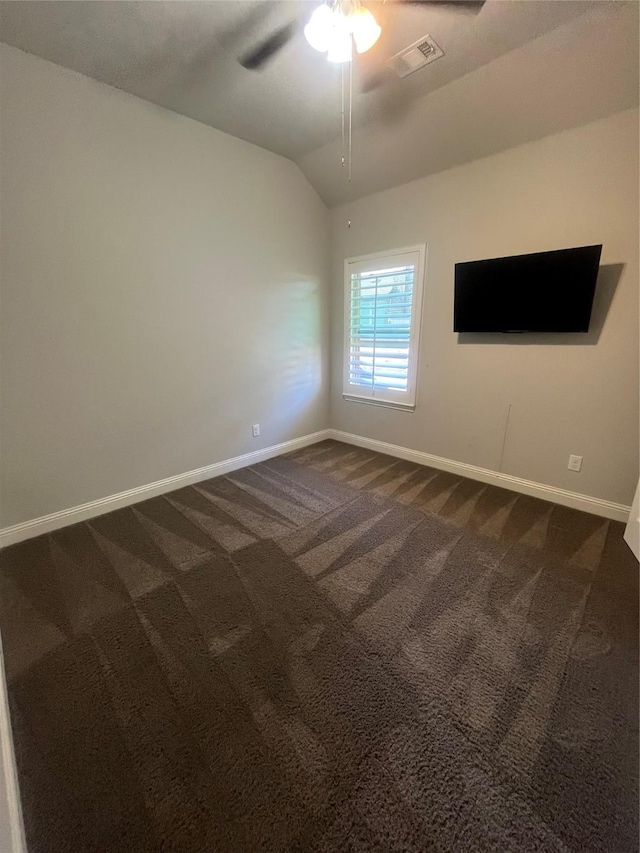 7040 Cross Point Ln, Little Elm, TX 76227 - empty room with baseboards, dark carpet, a ceiling fan, and vaulted ceiling