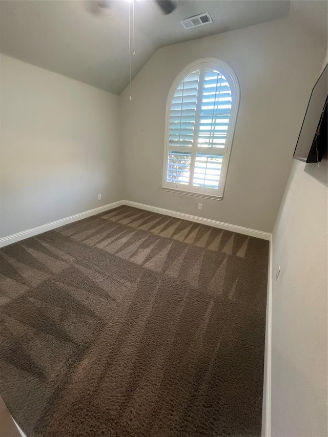 7040 Cross Point Ln, Little Elm, TX 76227 - unfurnished room with vaulted ceiling, baseboards, dark carpet, and a ceiling fan