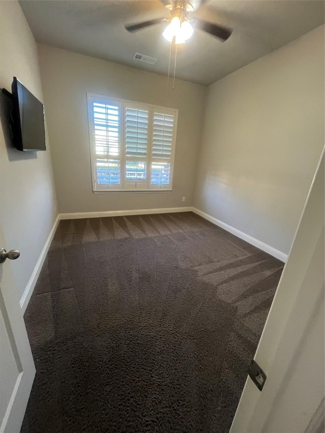 7040 Cross Point Ln, Little Elm, TX 76227 - spare room featuring ceiling fan, dark carpet, and baseboards