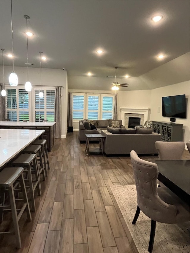 7040 Cross Point Ln, Little Elm, TX 76227 - living room featuring a ceiling fan, a fireplace, dark wood-style floors, and recessed lighting