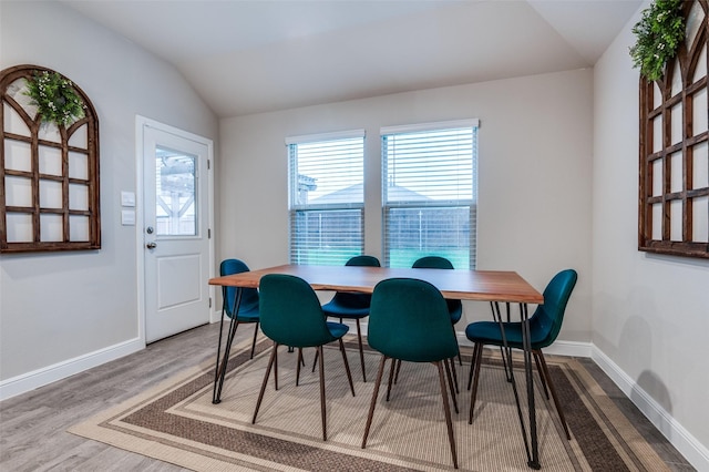 1349 Rolling Meadows Dr, Cedar Hill, TX 75104 - dining room featuring vaulted ceiling, baseboards, and wood finished floors