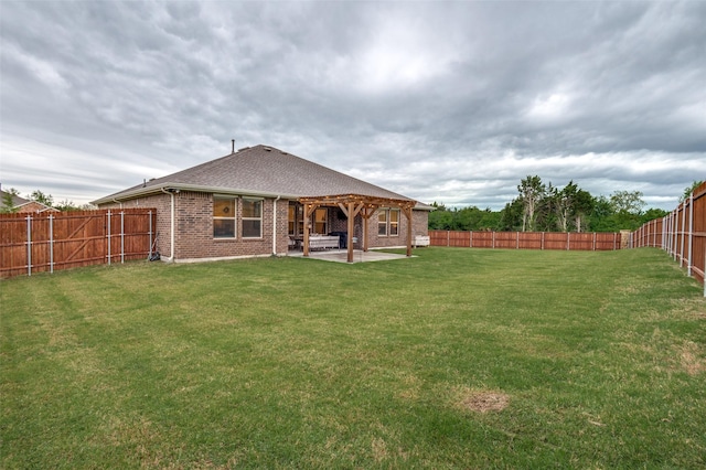 1349 Rolling Meadows Dr, Cedar Hill, TX 75104 - back of house with a yard, brick siding, a patio, roof with shingles, and a fenced backyard
