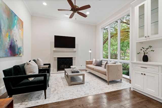 living area with recessed lighting, a ceiling fan, a healthy amount of sunlight, and wood finished floors