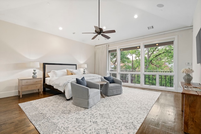 bedroom featuring wood finished floors, visible vents, recessed lighting, vaulted ceiling, and baseboards
