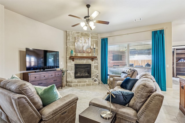 2828 Mariposa Dr, Grand Prairie, TX 75054 - living area with arched walkways, a ceiling fan, a stone fireplace, and stairway