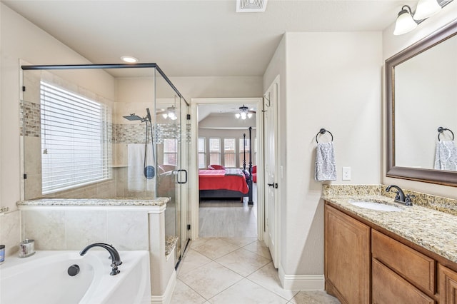 2828 Mariposa Dr, Grand Prairie, TX 75054 - bathroom featuring a stall shower, a garden tub, tile patterned floors, baseboards, and vanity