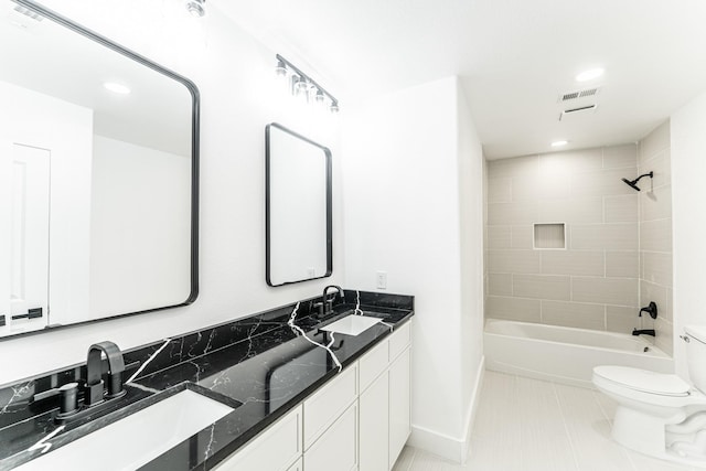 229 W Oaks Cir, Sulphur Springs, TX 75482 - full bath with toilet, double vanity, baseboards, tub / shower combination, and recessed lighting