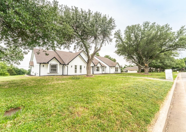 229 W Oaks Cir, Sulphur Springs, TX 75482 - view of front of home with a front lawn