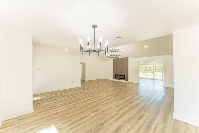 229 W Oaks Cir, Sulphur Springs, TX 75482 - unfurnished living room featuring a chandelier, light wood-style flooring, baseboards, and recessed lighting