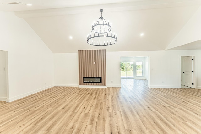 229 W Oaks Cir, Sulphur Springs, TX 75482 - unfurnished living room featuring light wood finished floors, baseboards, high vaulted ceiling, a chandelier, and a large fireplace